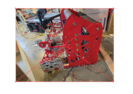 A photo of a physical robotics-club robot placed on the Illustrator artboard, selected with rotation handles active around it.